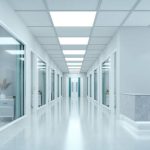 Empty corridor in modern hospital with information counter and hospital bed in rooms.3d rendering